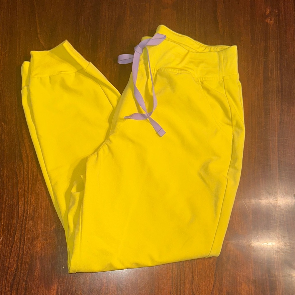 Figs Women’s Jogger scrub pants in bright Yellow with Purple Drawstring